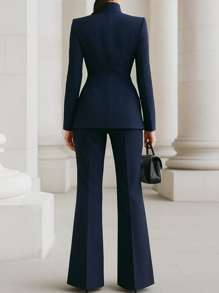 Vina suit set in white showing the stand collar neckline and tailored fit