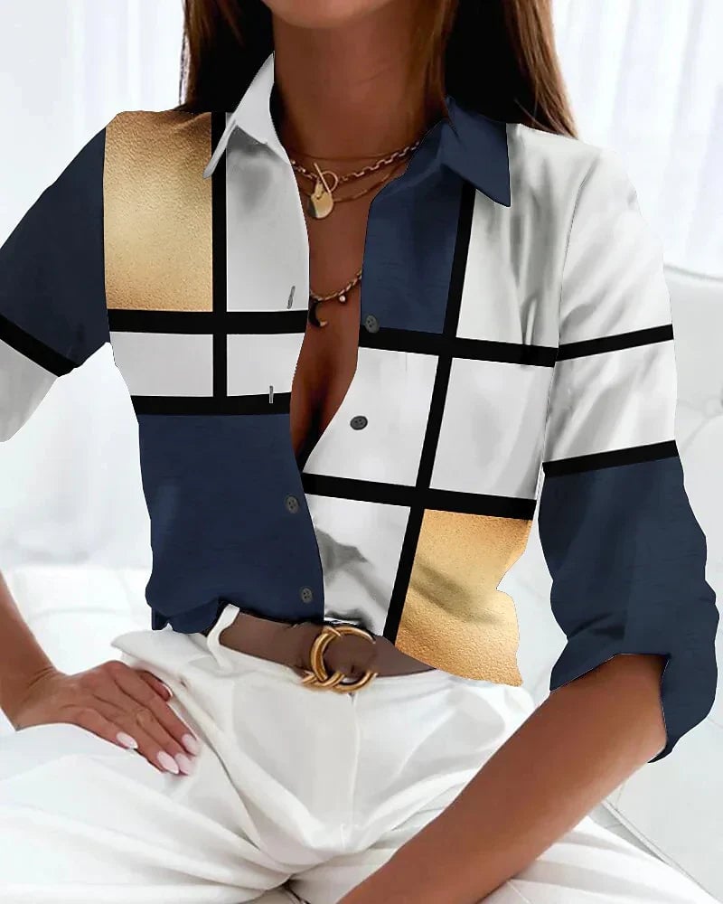 Model wearing the Viola contemporary printed blouse in a bold abstract pattern, front view