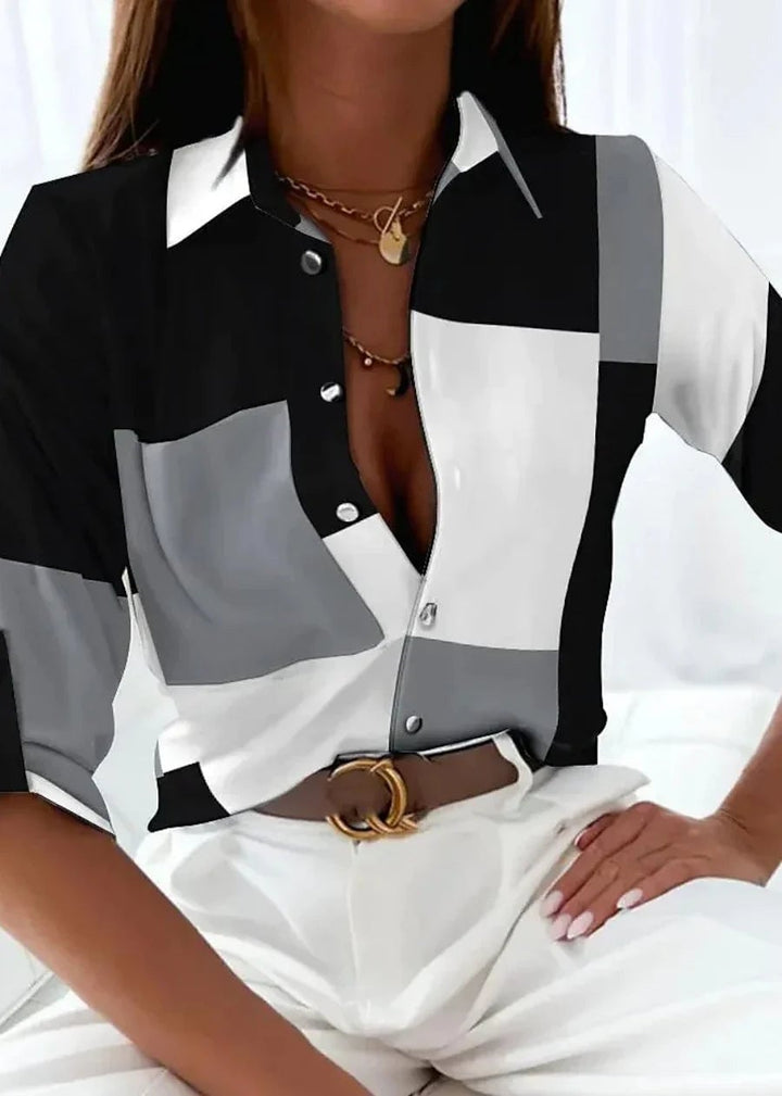 Close-up of the Viola blouse showing the artistic abstract print detail and soft fabric texture