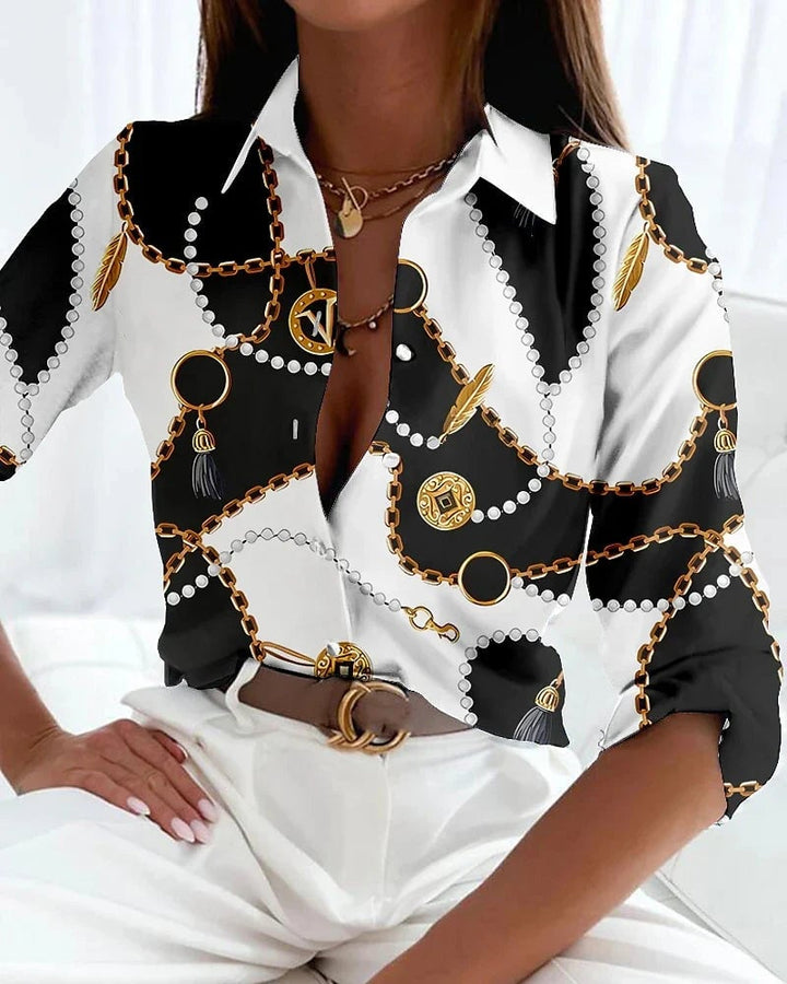 Viola contemporary printed blouse laid flat showing available colorways including gold and black