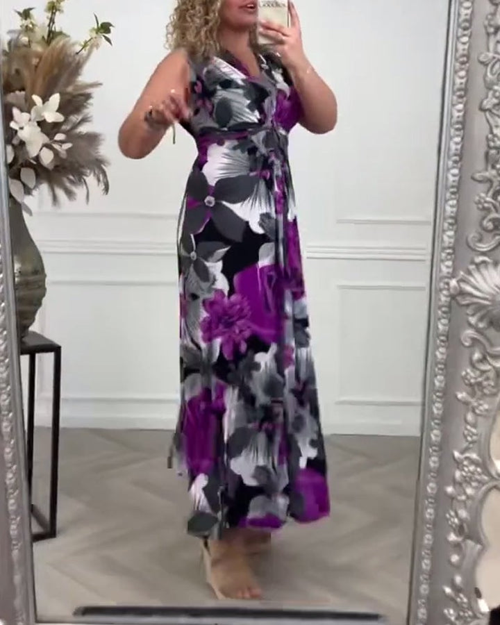 Detail shot of the bold large-scale floral print on the Viola maxi dress in purple and black