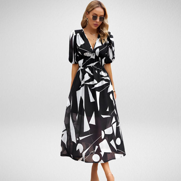 Front view of the Violet V-neck elegant dress in Black with a softly draped neckline