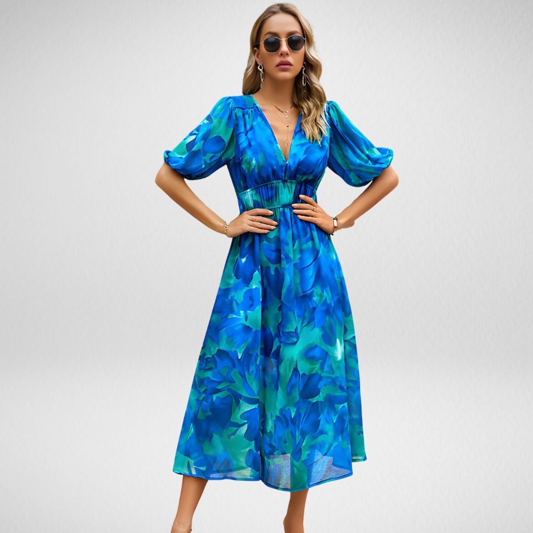 Side view of the Violet flowy dress in Blue highlighting the elegant silhouette and lightweight fabric
