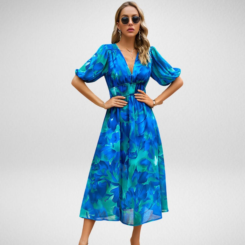 Side view of the Violet flowy dress in Blue highlighting the elegant silhouette and lightweight fabric