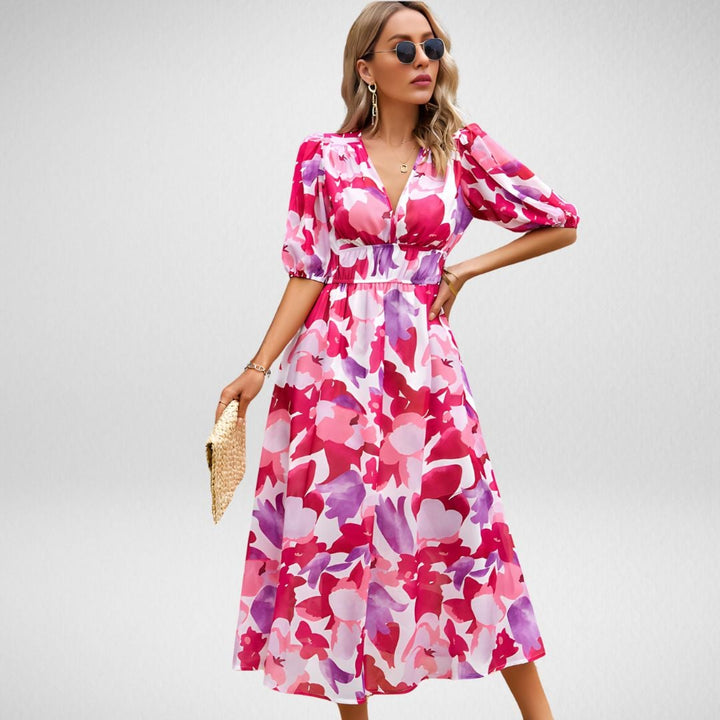 Full-length view of the Violet flowy dress in Green showing the flowing skirt and flattering fit
