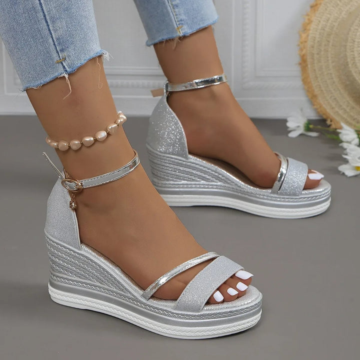 Side view of Violette cushioned sandals in silver showing ergonomic arch support and sleek feminine silhouette