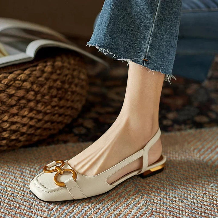 Side profile view of Virginia sandals in black showing the stable base and buckle ankle strap