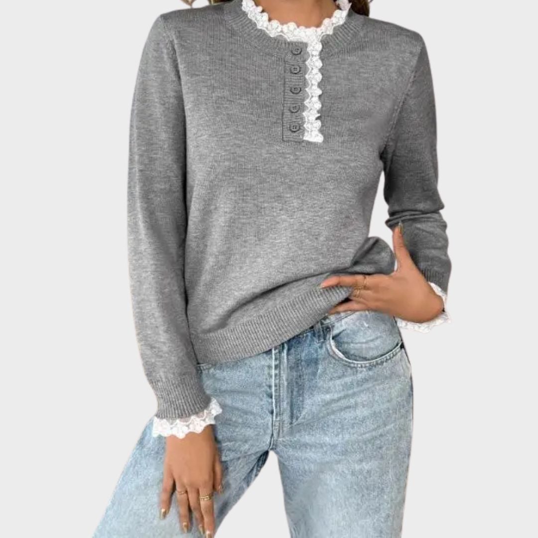Close-up detail of the gray Vivian retro sweater showing soft knit texture and vintage accents