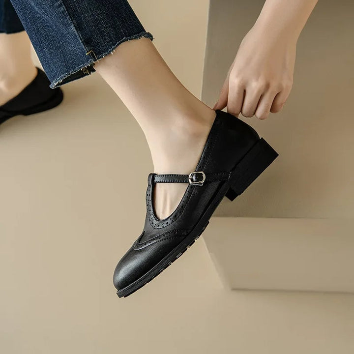 Vivian T-strap Mary Jane shoes in brown showing adjustable buckle strap, side view