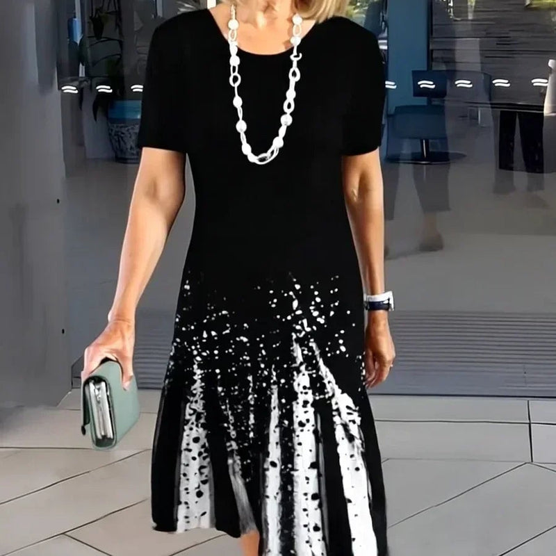 Front view of the Vivid print midi dress in colorful color-block stripe on a model
