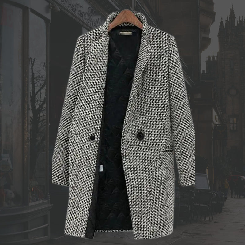 Side profile of the Vivienne long winter coat highlighting its structured yet fluid tailored shape