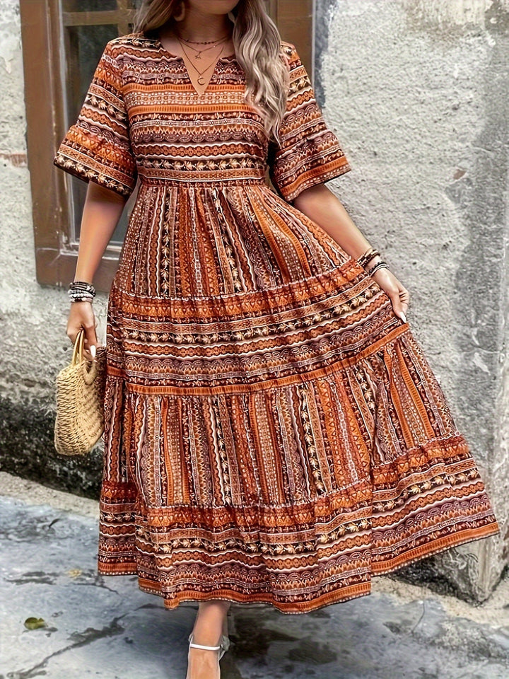 Back view of Vivienne women's boho flowy dress in ethnic-inspired green print