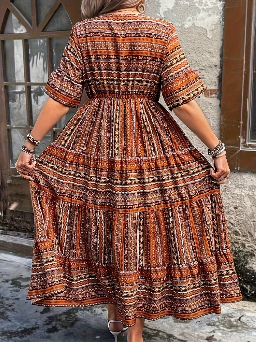 Lifestyle shot of Vivienne boho printed draped dress styled for a casual summer look