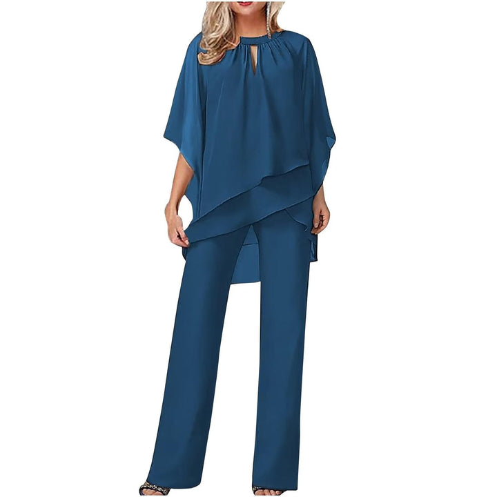 Full-length back view of the Vivienne chiffon pantsuit in royal blue styled with heeled sandals
