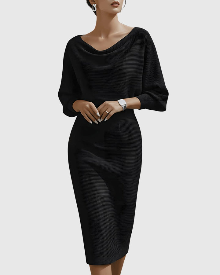 Woman wearing a black ribbed cowl neck batwing sleeve midi dress with fitted pencil skirt silhouette