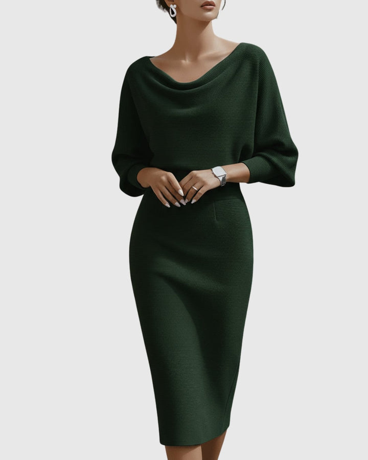 Side view of black ribbed midi dress highlighting batwing sleeves tapering to fitted cuffs