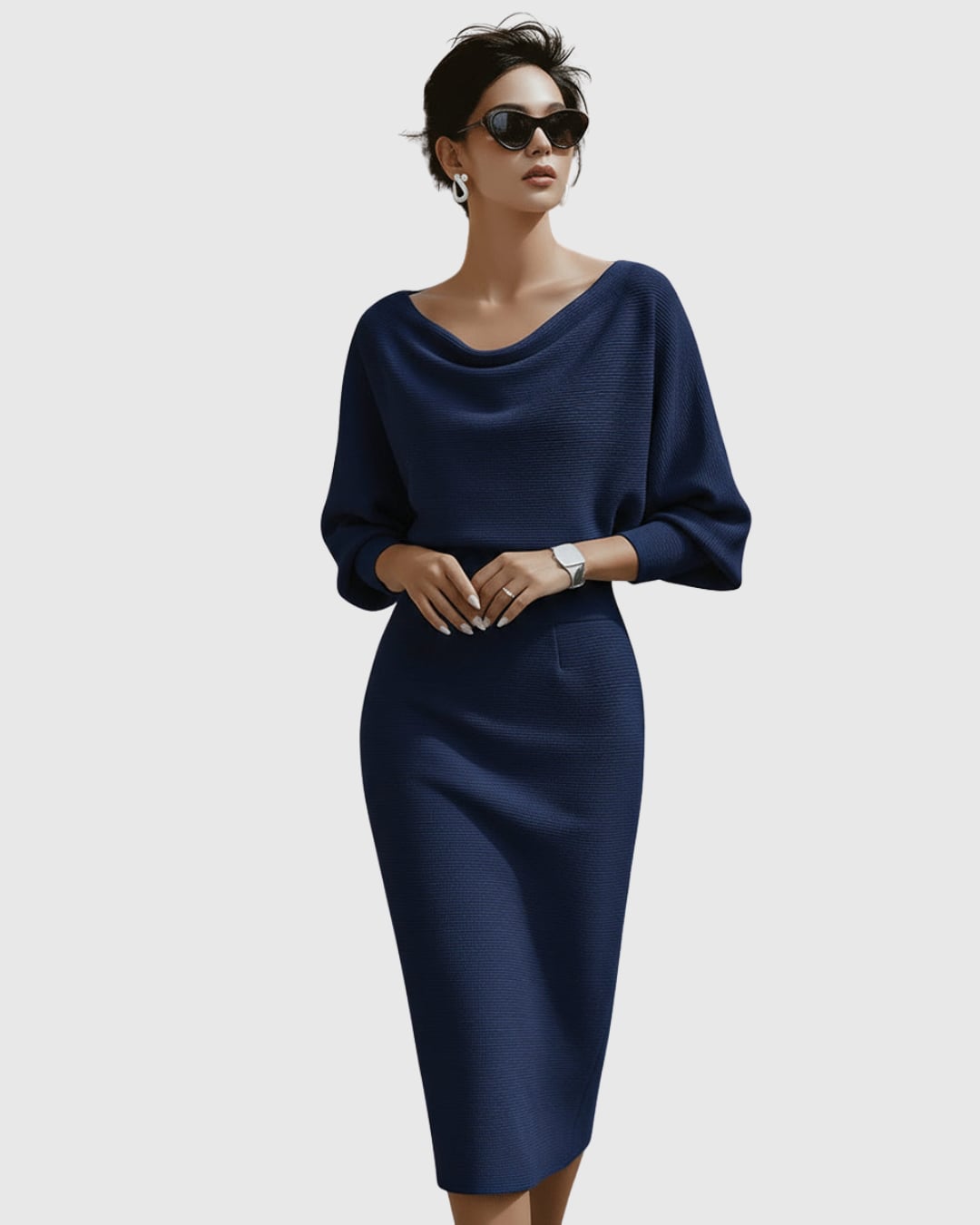 Woman in gray ribbed cowl neck batwing midi dress styled with heeled sandals
