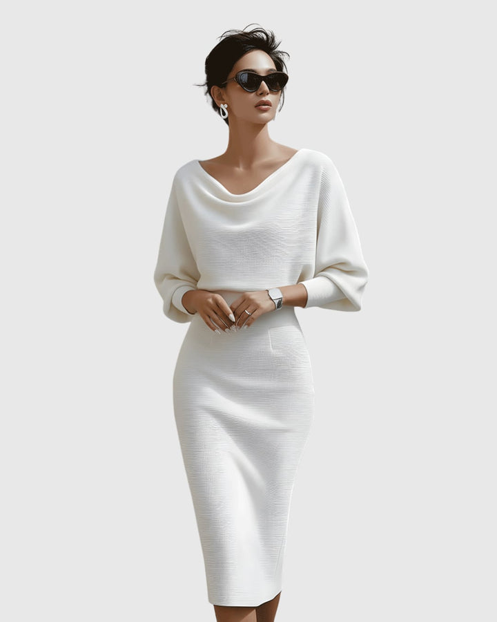 Navy blue ribbed cowl neck midi dress with batwing sleeves on a model