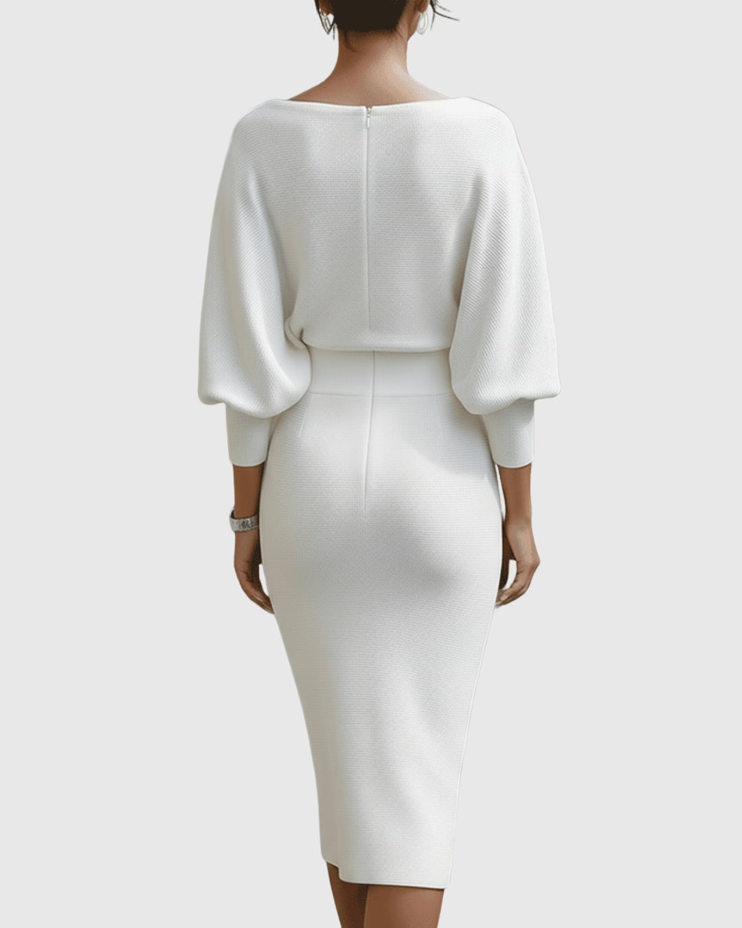 Flat lay of the Vivienne ribbed midi dress showing fabric texture and batwing sleeve shape