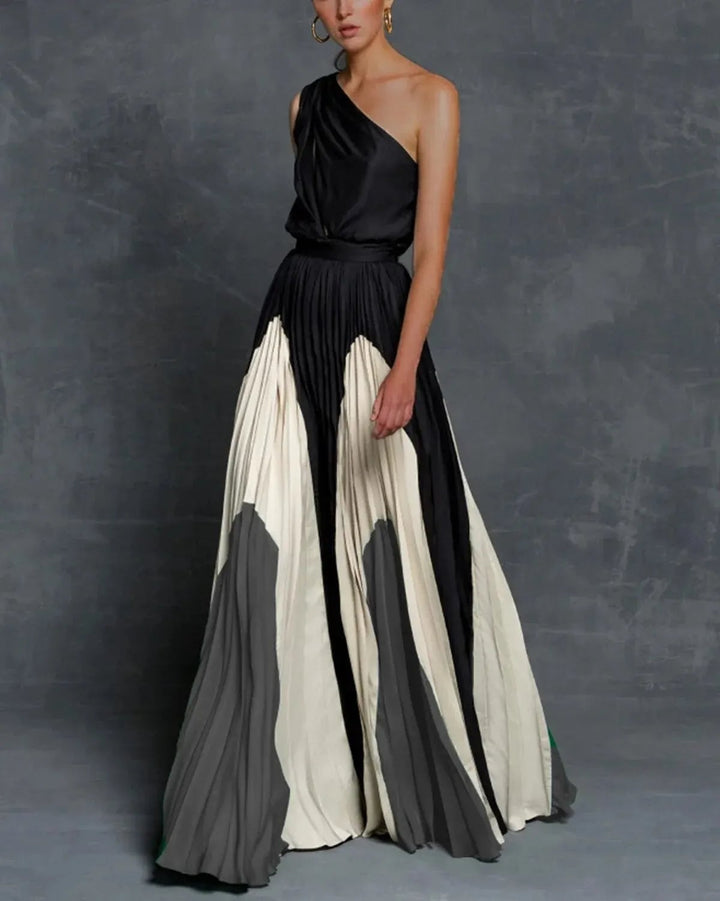 Back view of the Vivienne color block pleated maxi dress showing the flowing skirt with dramatic pleat detail