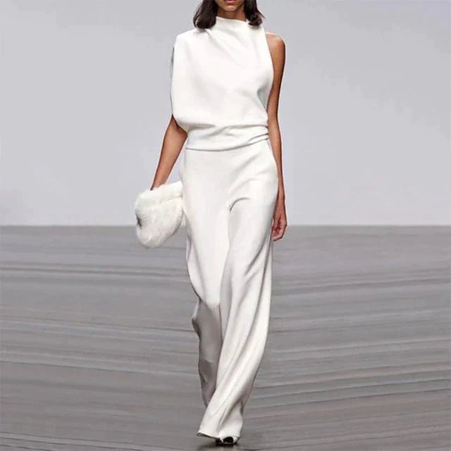 Side view of the Vivienne floor-grazing wide-leg jumpsuit showing the draped bodice and clean trouser silhouette