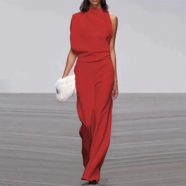 Vivienne jumpsuit styled with strappy heeled sandals, shown in a vibrant solid color option