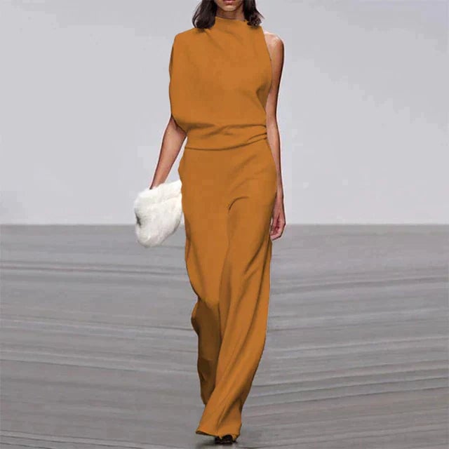 Model wearing the Vivienne mock neck jumpsuit in classic black, demonstrating the elongating wide-leg silhouette