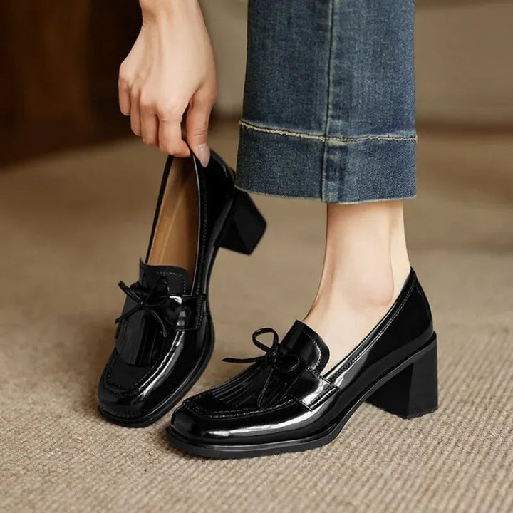 Vivienne tassel loafer pump in glossy black with block heel and round toe, front view