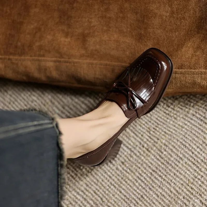 Vivienne tassel loafer pump in glossy black, top-down view of round toe