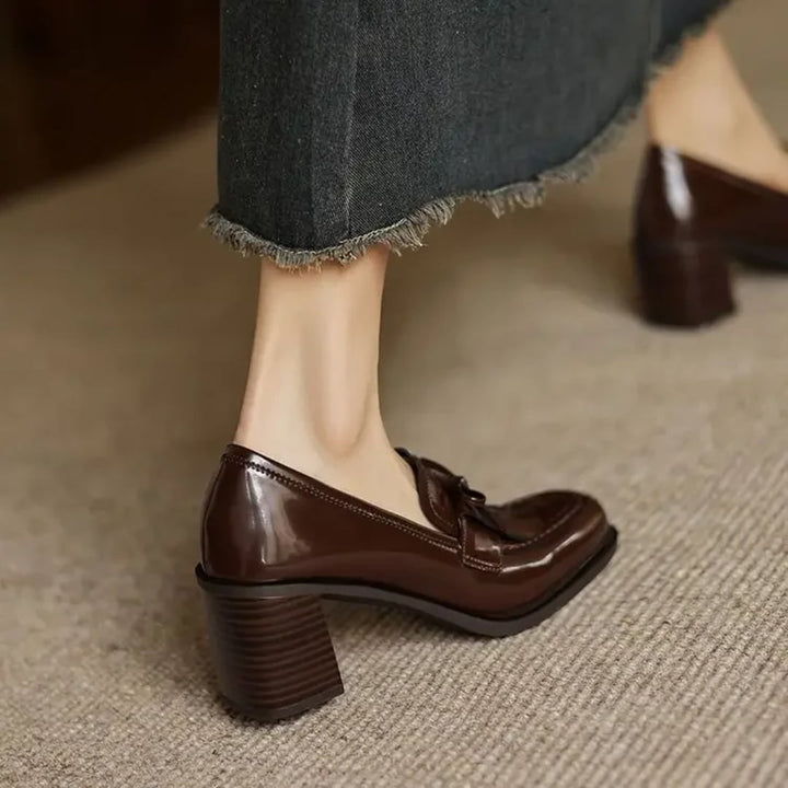 Vivienne tassel loafer pump in deep dark brown, side profile showing block heel
