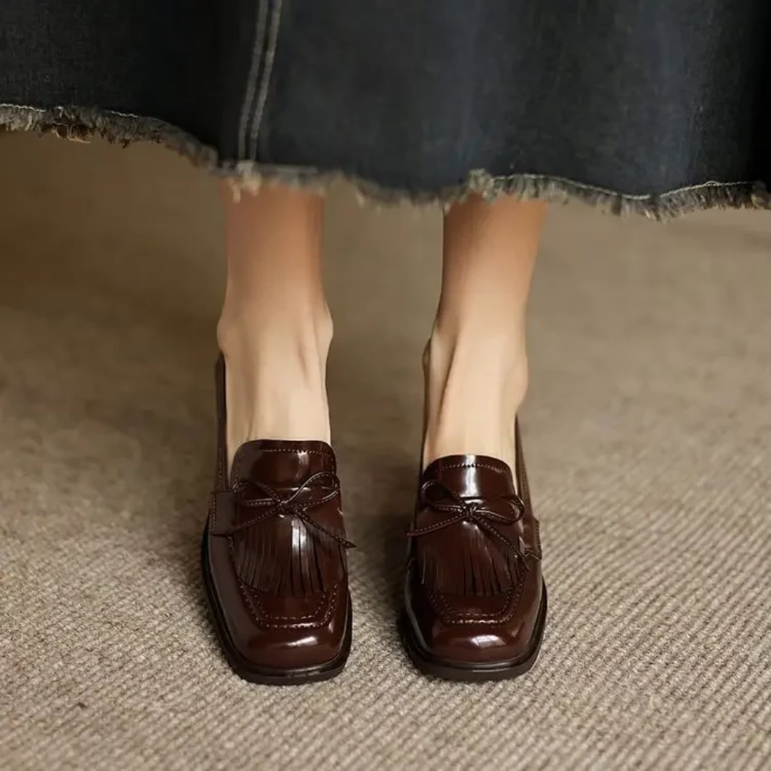 Close-up of fringe tassel accent on Vivienne brown loafer pump