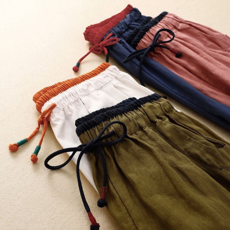 Close-up of the contrast stretch waistband on relaxed summer pants in olive green