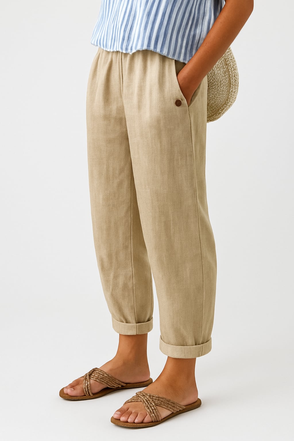 Animated view of straight-leg pants with rolled cuffs and side pockets shown on a model in a neutral colorway