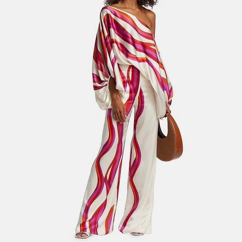 Front view of the fuchsia and red wave stripe off-shoulder two-piece set with wide-leg pants from Florimay