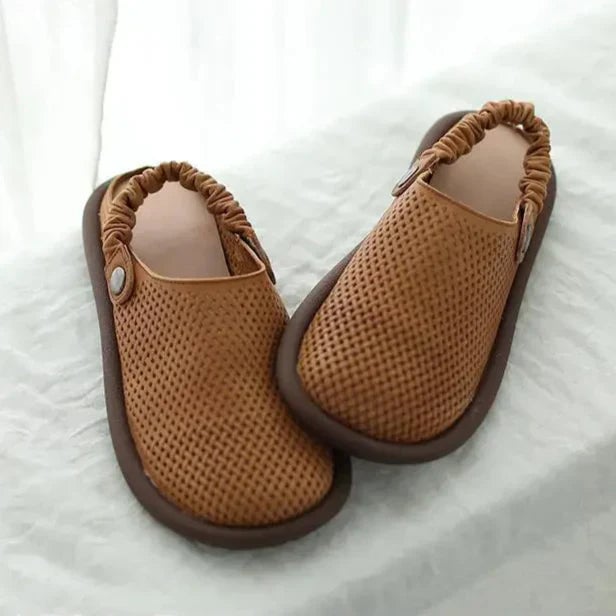 Model wearing Waverly brown sandals styled with a casual summer dress, full-length lifestyle shot