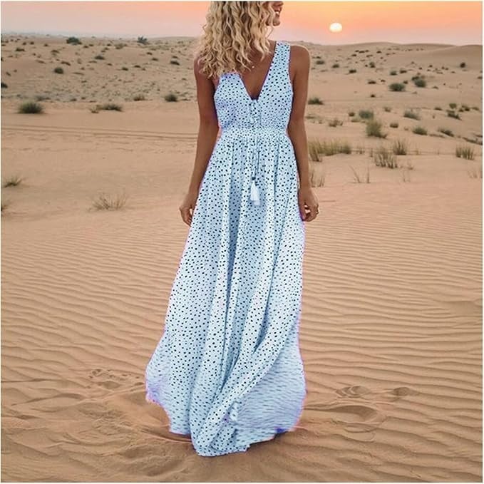 Side view of a woman in a sky blue polka dot boho maxi dress highlighting the flowing fabric