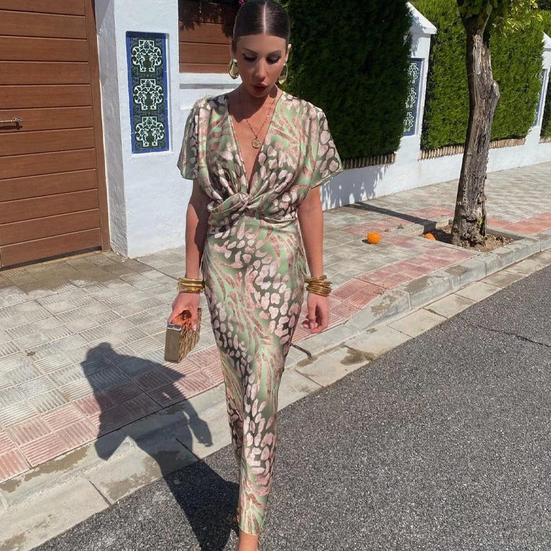 Woman wearing the Waverly sleek feminine wedding guest dress with a lustrous finish, front view