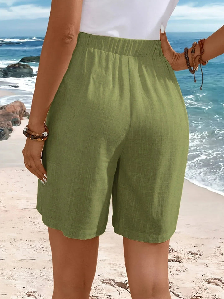 Close-up of elastic waistband on comfortable mid-thigh shorts in yellow