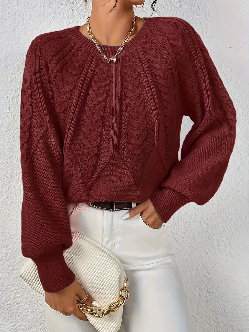 Close-up front view of the Willow modern cable-knit sweater highlighting detailed cable-knit pattern and soft fabric