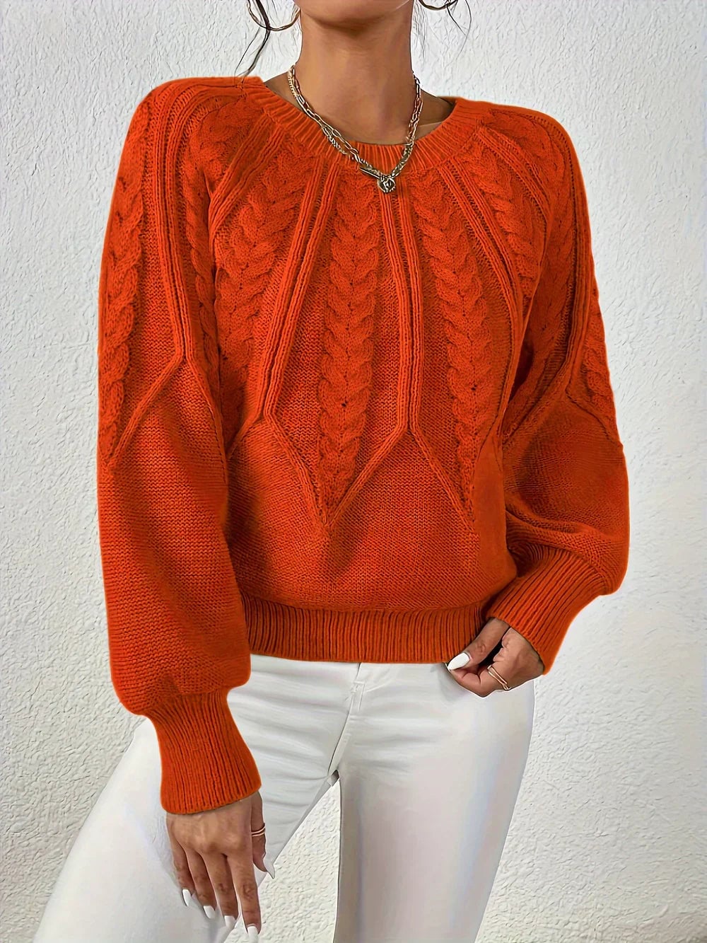 Detail shot of the cable-knit texture on the Willow sweater, showing depth and craftsmanship