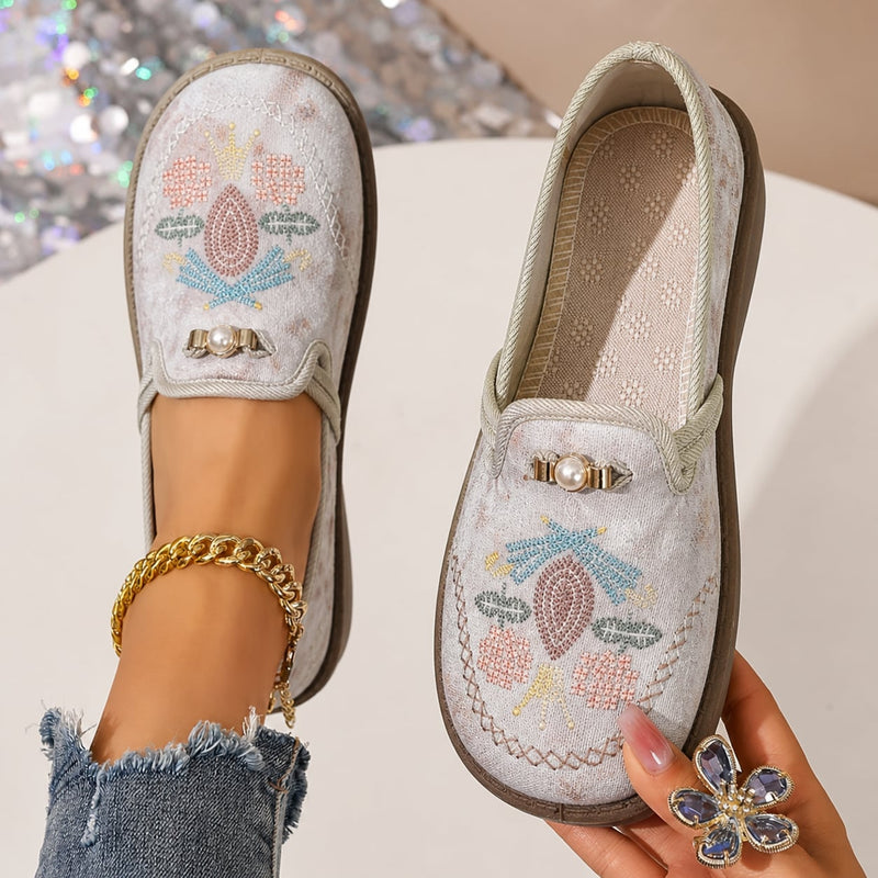 Side view of Willow floral loafers in gray showing intricate embroidery and pearl accent details