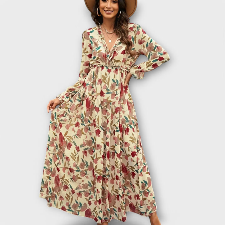 Model wearing a navy blue floral maxi dress with a flattering fit