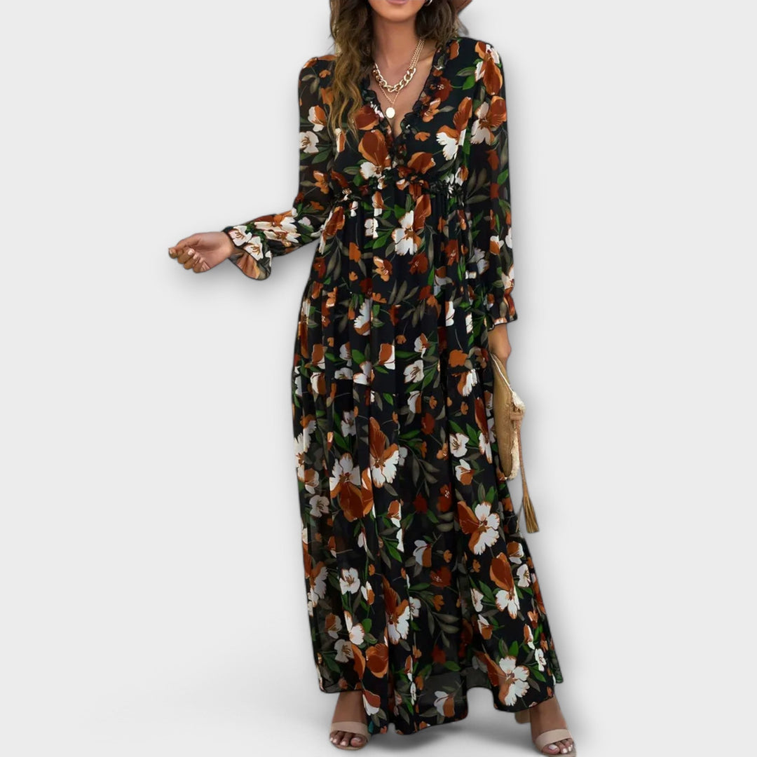Back view of a flowing floral maxi dress in rose pink
