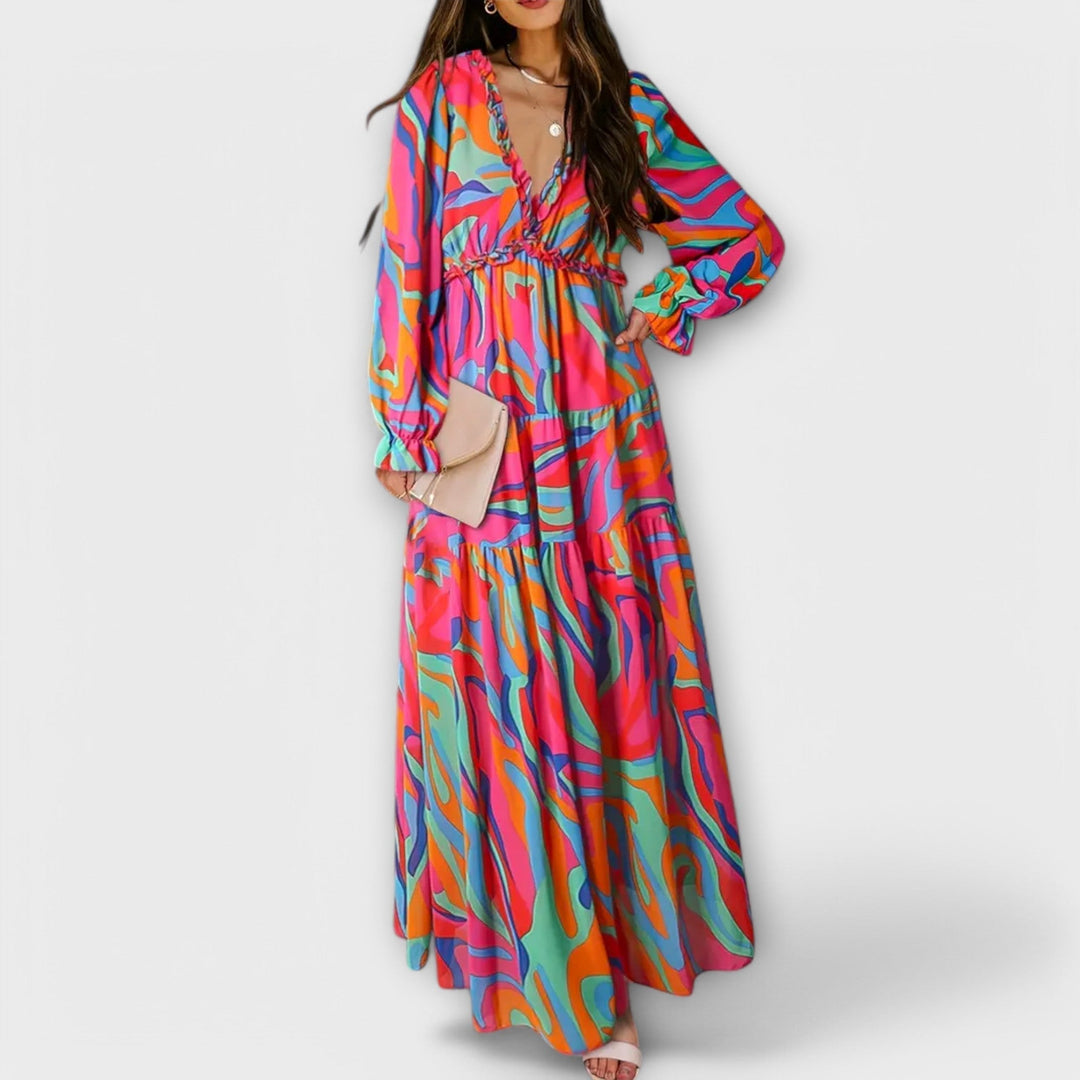 Model in a black floral V-neck maxi dress for an evening occasion