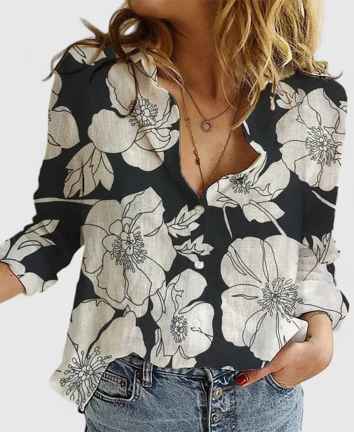 Women's floral V-neck long sleeve blouse in black with botanical print, front view
