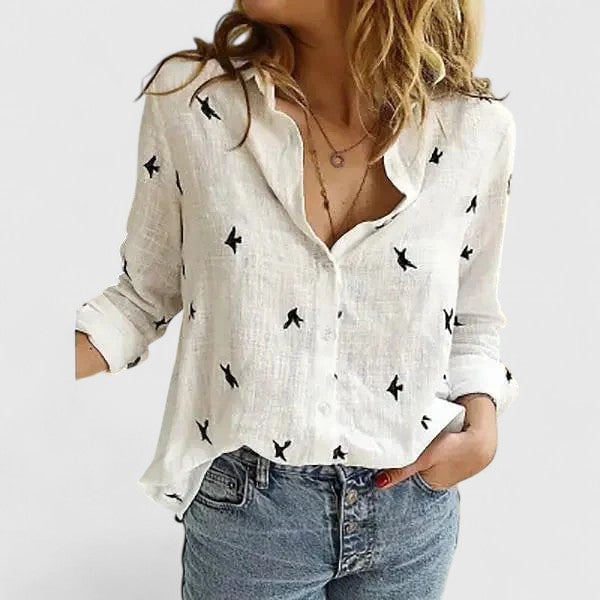Women's floral V-neck blouse in pink, showing long sleeve detail
