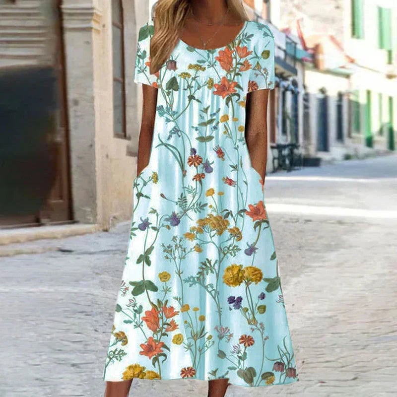 Back view of a floral short sleeve midi dress featuring a botanical print and elegant midi hemline