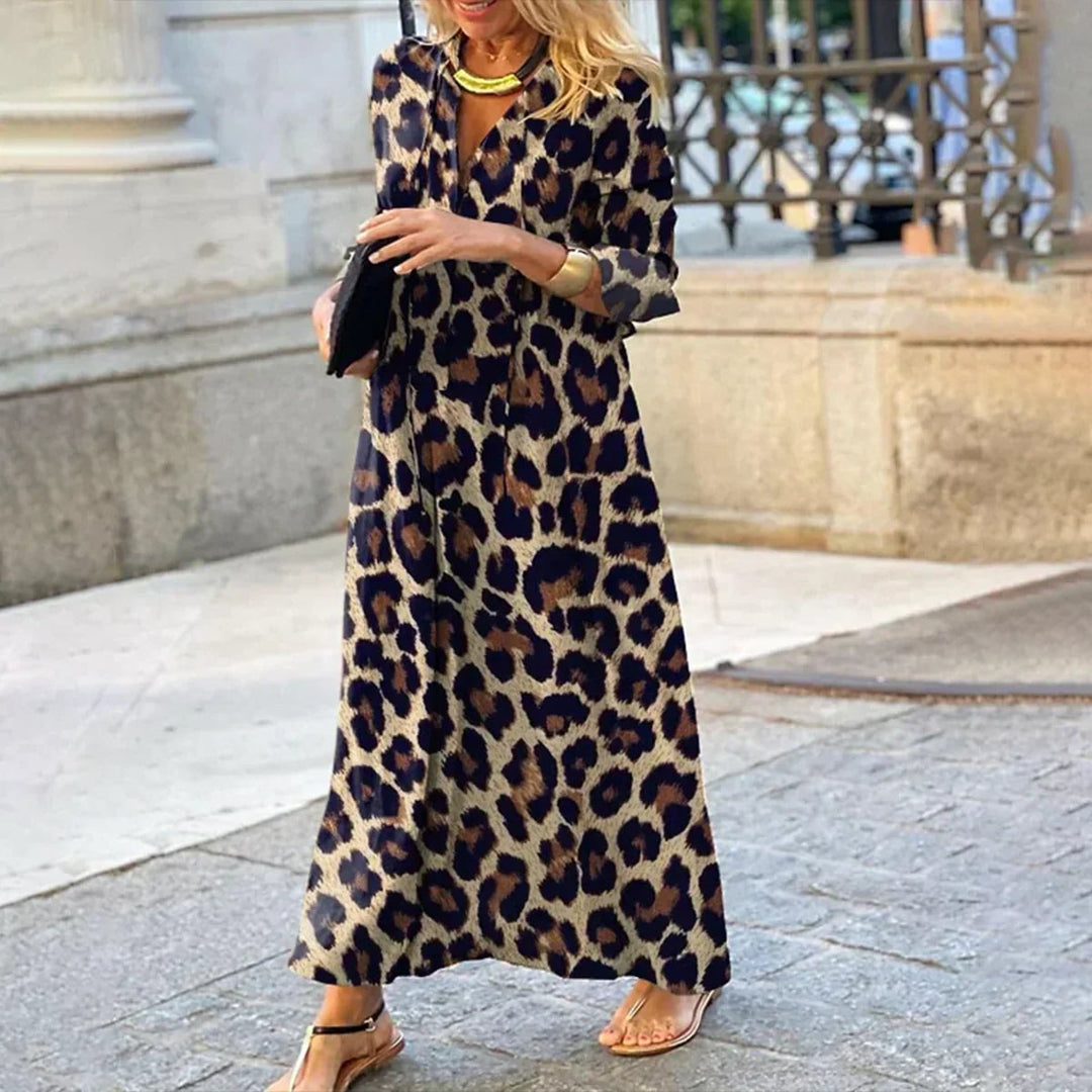 Close-up detail of the leopard print fabric and draped design of the women's fitted dress