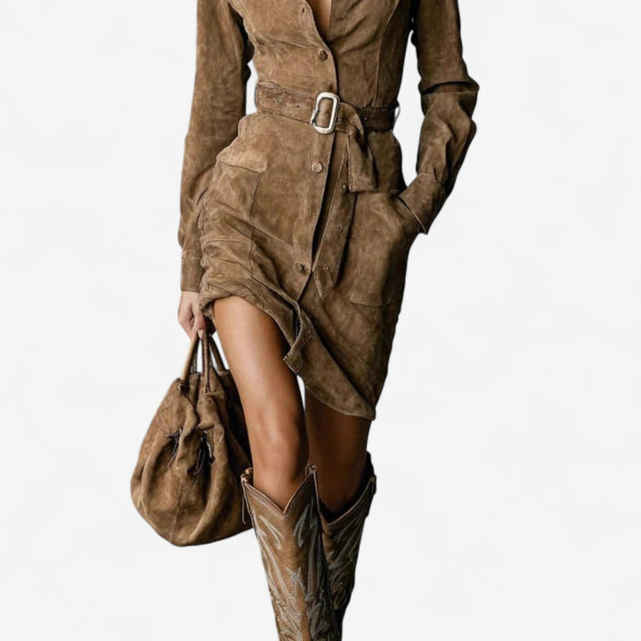 Close-up detail of the luxurious fabric drape and elegant detailing on a brown classic dress
