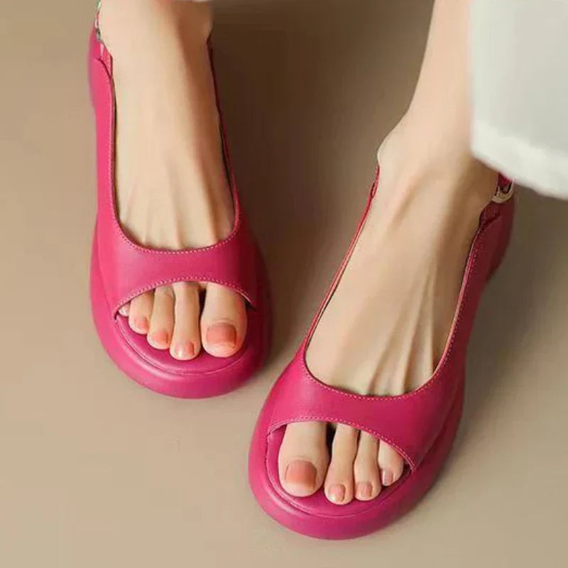 Close-up of Wren platform sandal sole and heel in Apricot showing cushioned footbed